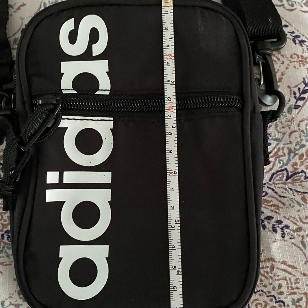 ADIDAS small crossbody purse. Black w/white letters. Zipper top. Zipper front